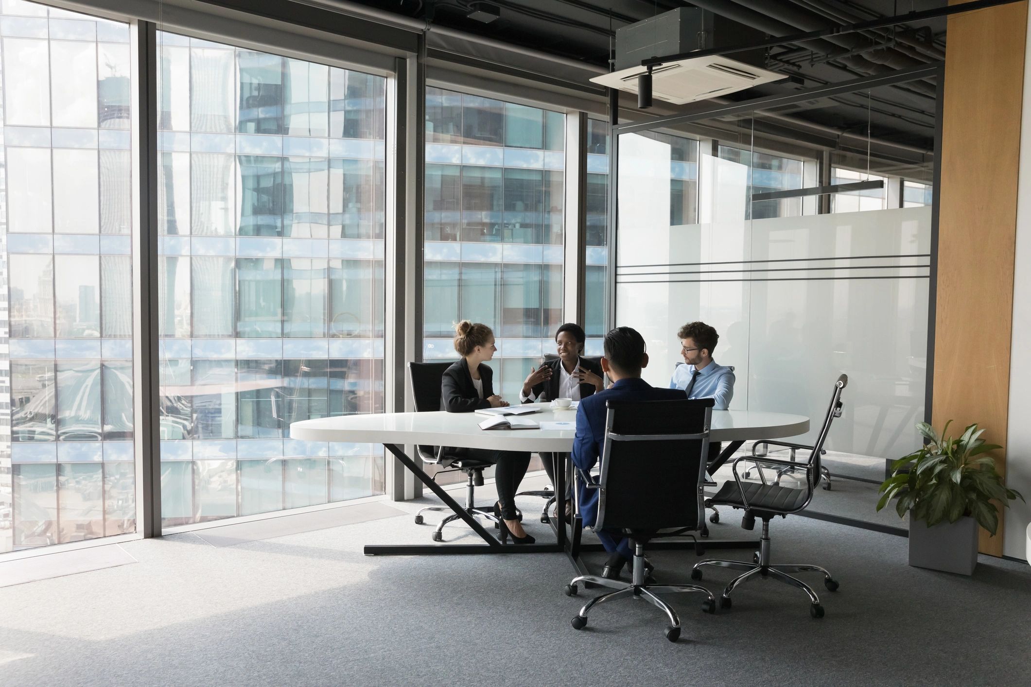 Business team discussing strategy in a modern meeting room