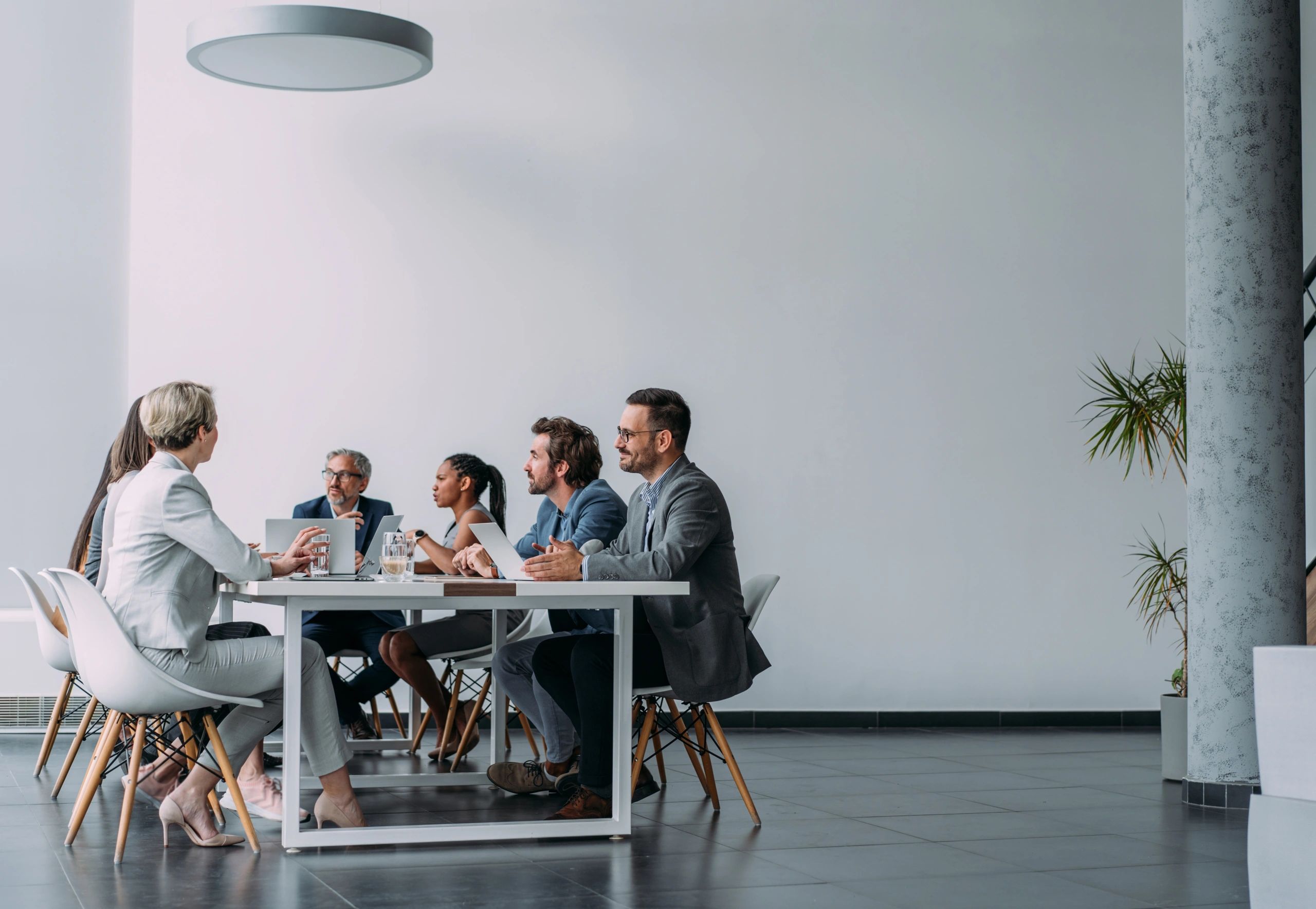 Corporate team discussing operations in a meeting
