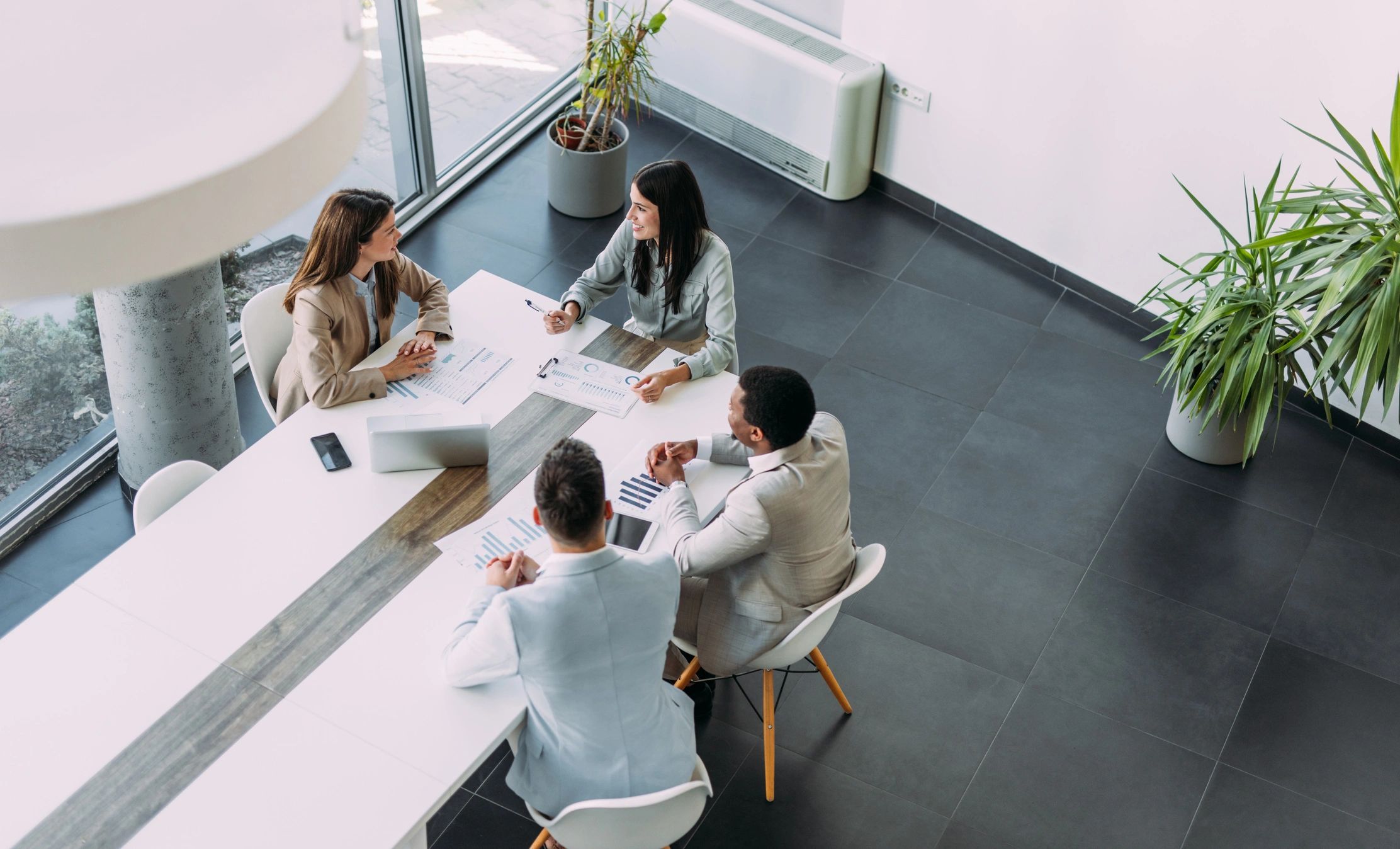 Business professionals collaborating around a meeting table